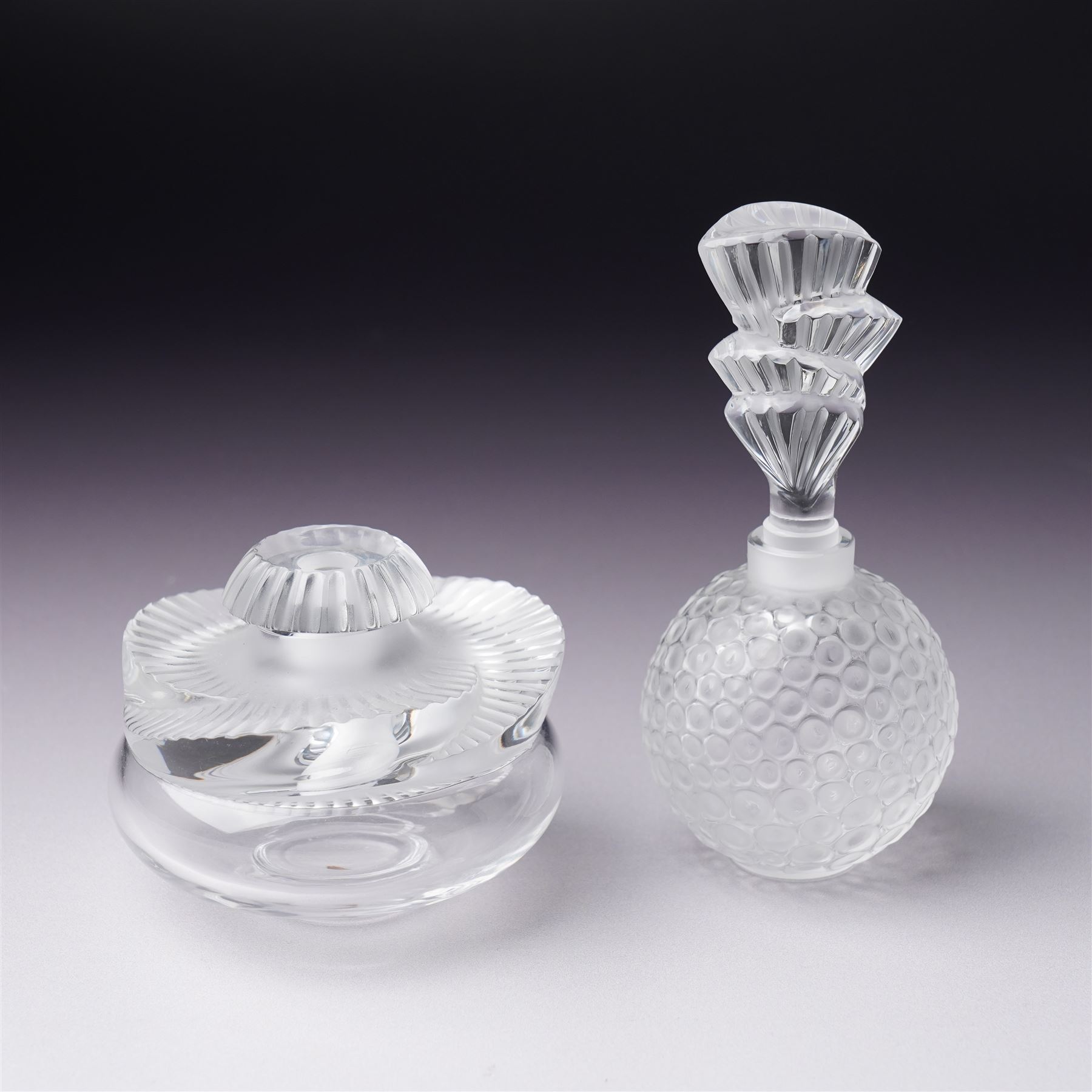 Lalique 'Baptiste' clear and frosted glass scent bottle H6cm and another Lalique 'Palmette' scent bottle H11cm both inscribed 'Lalique, France' (2) 