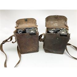Two US signal Corps (US army) WWII era field telephones, both complete in brown leather cases, Model E-E-8-A. 