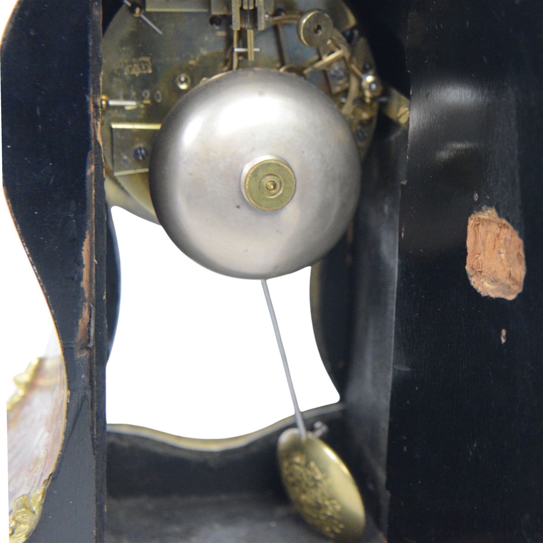 Louis XV-style gilt-bronze mounted turtleshell boulle mantel clock, the case of typical waisted form, gilt bronze foliate scroll and rocaille mounts, raised on scroll feet. Eight-day Paris movement signed “Rollin à Paris”, with outside count-wheel striking half-hourly on a single bell, the going train with anchor escapement. The circular foliate gilt bronze dial with enamelled Roman hour numerals and twin winding apertures, fitted with pierced blue steel hands and bevelled glass cover, with pendulum and key, circa 1860