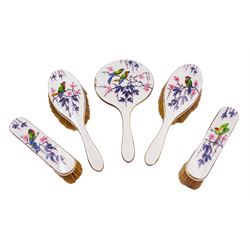 1920's five piece silver mounted and enamel dressing table set, comprising pair of hair brushes, pair of clothes brushes, and hand held mirror, each decorated verso with birds perched upon blossoming branches, hallmarked Henry Clifford Davis, Birmingham 1927 and 1928