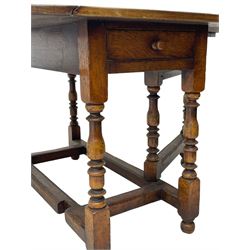 19th century oak dining table, oval drop-leaf top on gate-leg action base, turned supports united by turned stretchers, fitted with single end drawer