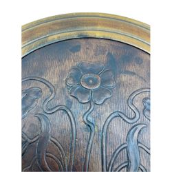 Beech adjustable piano stool, with leather inset seat embossed with floral Art Nouveau style decoration, on turned ribbed globular column with three splayed supports