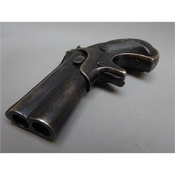  Remington .41 calibre over and under bouble barrel derringer, the 7.5mm barrels marked to the top Remington Arms - U.M.C. Co. Ilion. N.Y., hinged and rising for loading with checkered black plastic bird's head grip L13cm  
