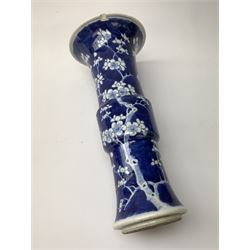 Japanese Meiji period miniature Satsuma bottle vase, painted with panels of figures below a green ground neck, H10cm together with a 19th/early 20th century Chinese blue and white Gu vase, painted with prunus flowers and bearing four character Kangxi mark to base, H25.5cm (2)