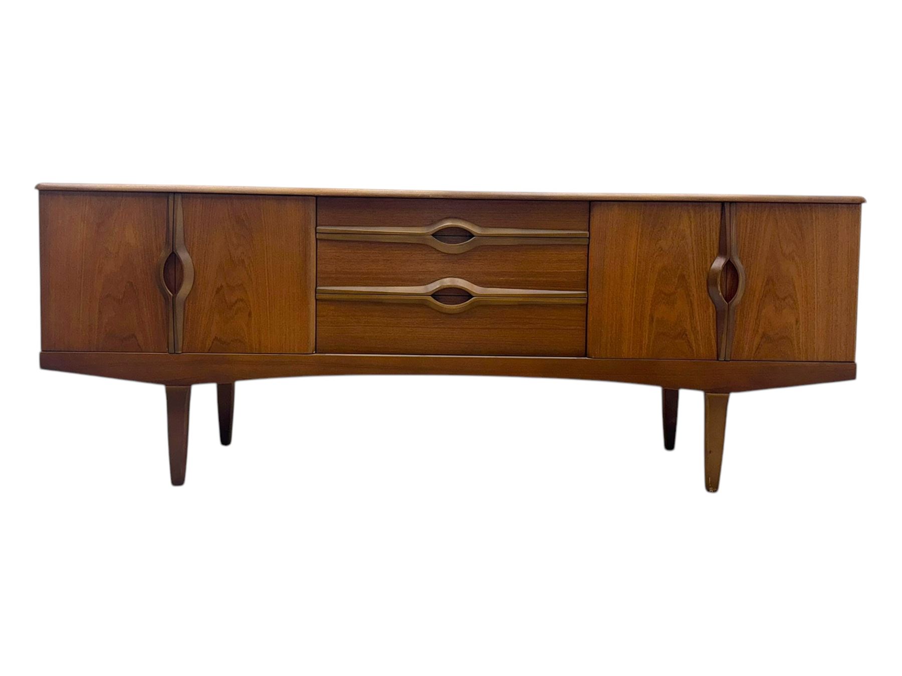 Stonehill - mid-20th century teak sideboard, three central drawers flanked by concertina cupboard doors, on tapering supports