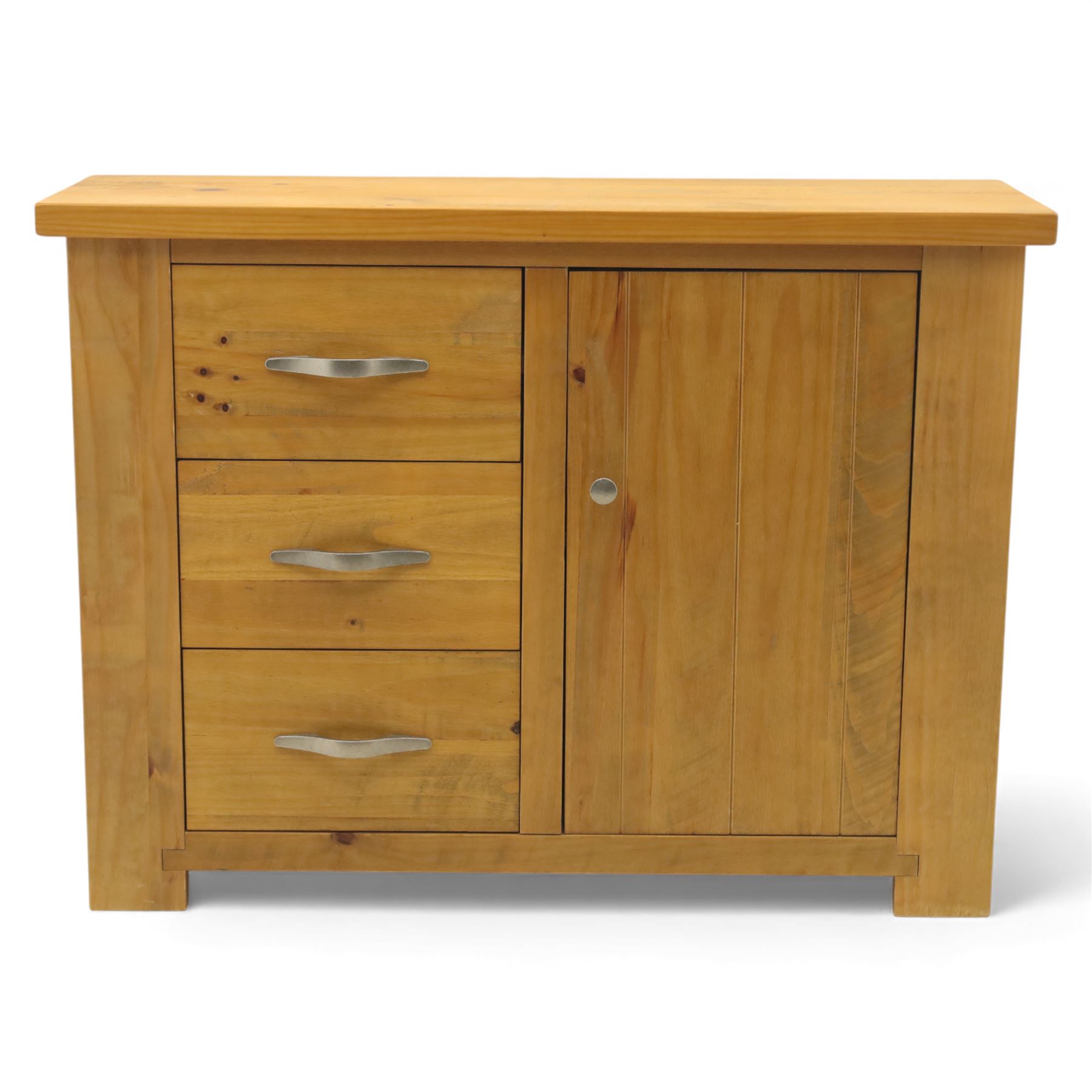 Contemporary pine side cabinet, rectangular top with moulded edge, fitted with three drawers with brushed metal handles alongside a single cupboard door with round metal knob, plain sides, raised on square block feet