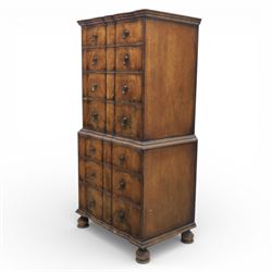 Early 20th century Queen Anne revival walnut chest on chest, the shaped cornice over an arrangement of four long drawers above three further long drawers, figured walnut veneers with feather banding and crossbanding, on turned bun supports