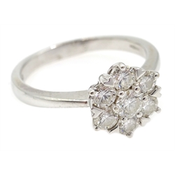  White gold seven stone diamond flower cluster ring, hallmarked 18ct, stamped DIA 100  