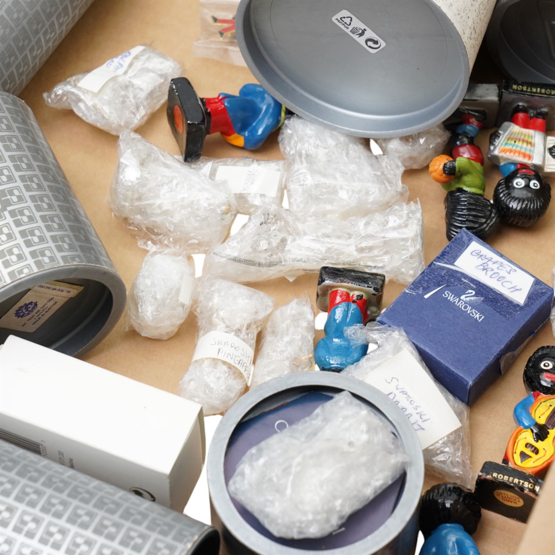 Collection of Swarovski figures, including Grapes brooch, dog, nativity scene etc, and approximately 13 Golly figures