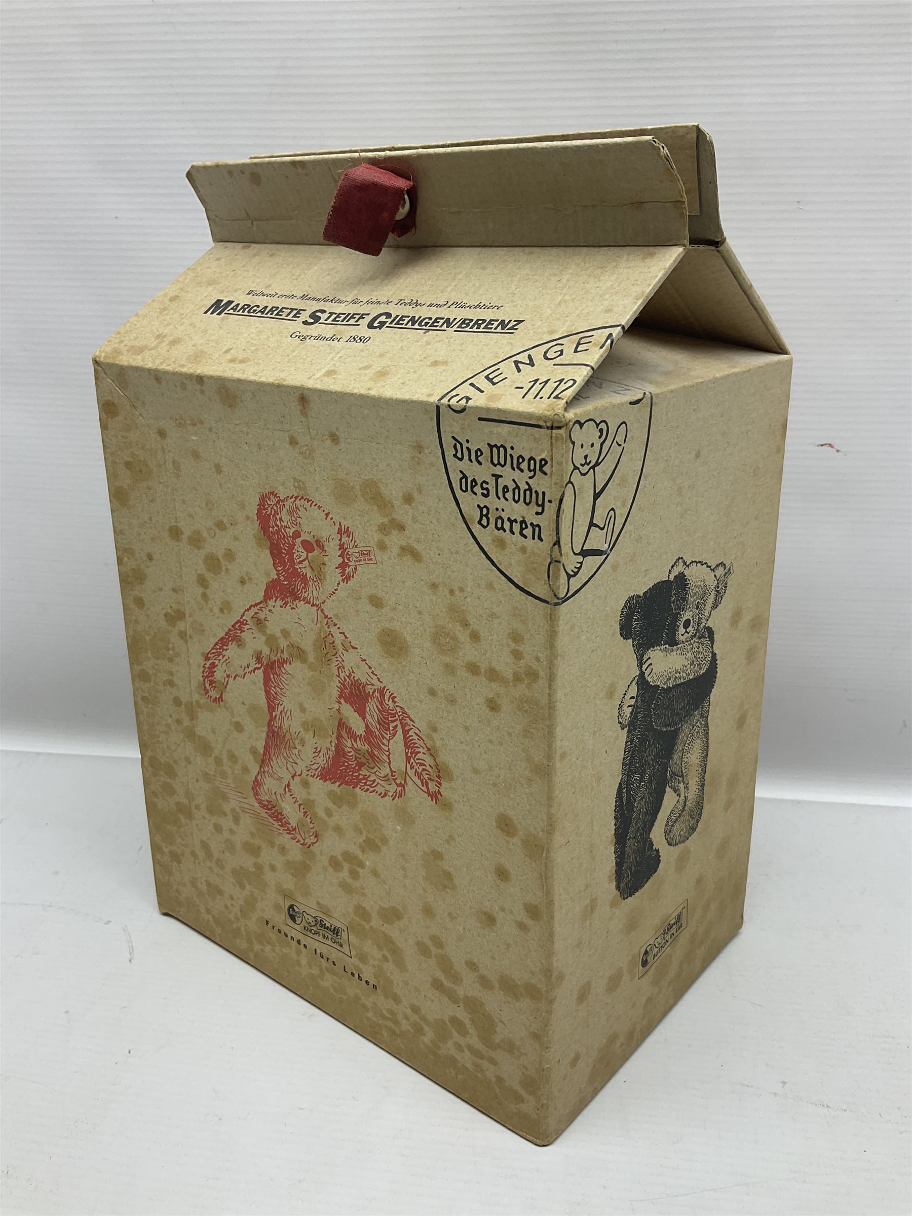 Modern Steiff teddy bear - The Millenium Bear No.34709 with golden pendant H32cm; in original box with paperwork; together with a Steiff ball-point pen in case sent to the vendor as compensation for a delay in receiving the bear.