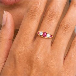 Early 20th century gold ruby and diamond five stone marquise set ring, principal oval cut ruby of approx 0.60 carat, flanked by two old cut diamonds and two round cut rubies, stamped 18ct, total diamond weight approx 0.80 carat