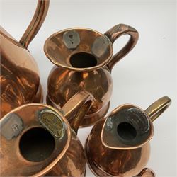 Eight graduated copper haystack jugs, ranging from quart to 1/8 pint, largest H16cm, smallest 6.5cm. 