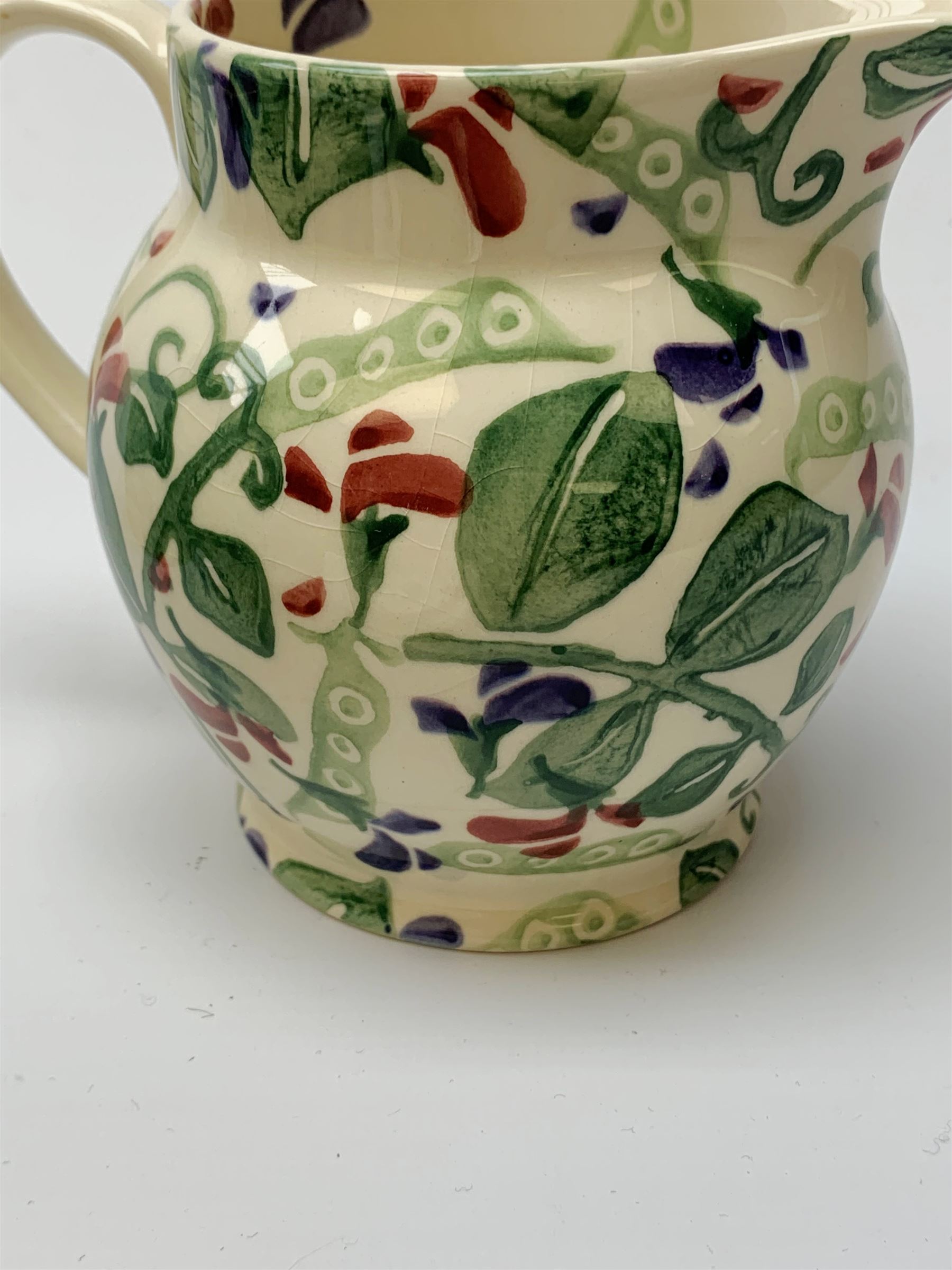 Four Emma Bridgewater mugs, together with a jug, and preserve pot and cover, decorated in sweet pea pattern, mugs H7cm. (5). 