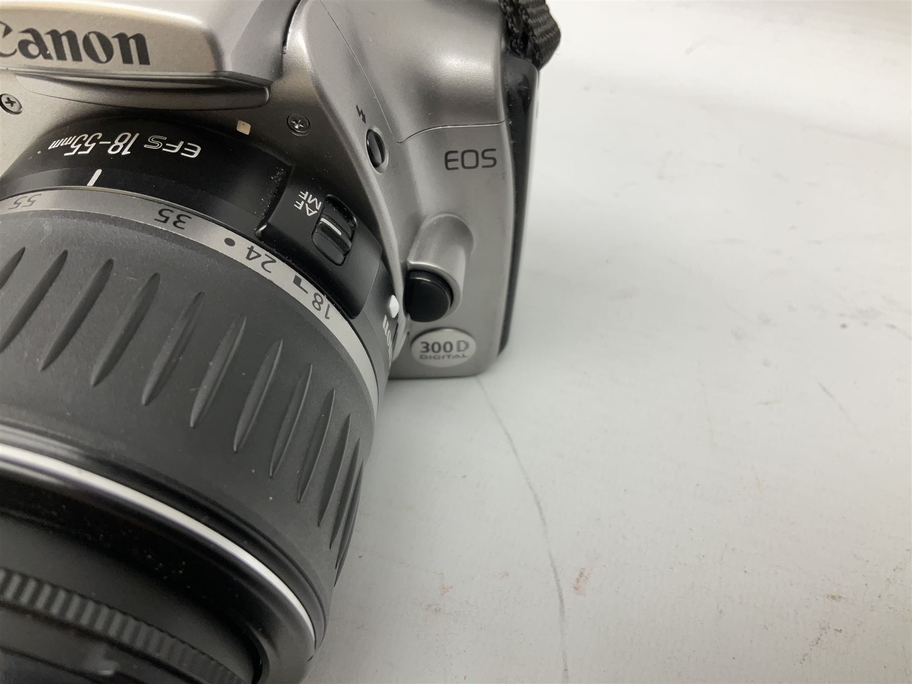 Canon EOS 300D Digital SLR in silver, with Canon 'Zoom Lens EF-S18-55mm 1:3.5-5.6', with soft shell bag and instruction manual