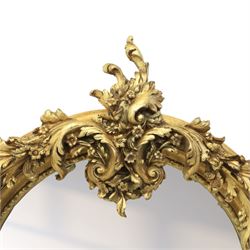 Pair of Louis XV style giltwood overmantel mirrors, the arched rectangular frame surmounted by an elaborate pierced cresting of acanthus scrolls, rocailles and floral swags, the moulded frame with continuous foliate carving and beaded inner slip