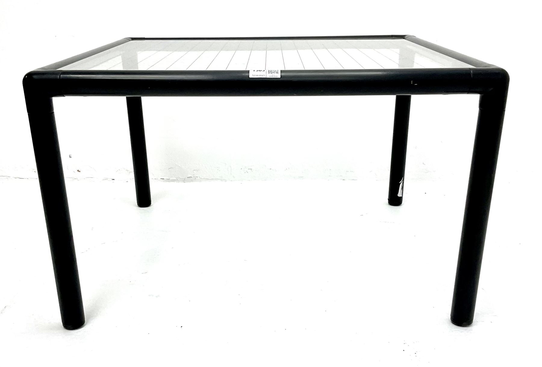Habitat - tubular steel coffee table, inset glass top with red line grid
