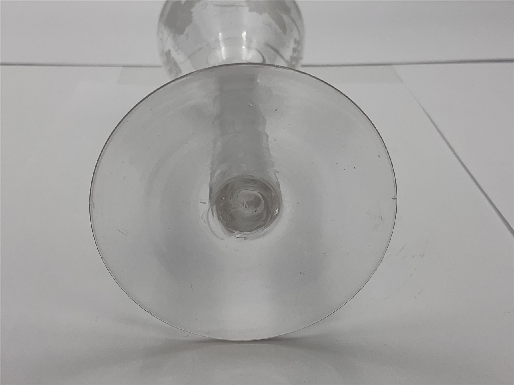 Set of three 18th century style wine glasses, each with funnel bowl etched with fruit vine, upon a double series air twist stem and circular foot, H17cm