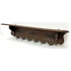 20th century French oak wall hanging coat rack, relief carved with scrolls and acanthus leaves, six gilt hooks cast with masks