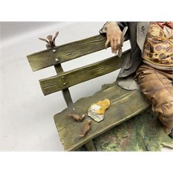 Two Capodimonte figures, comprising The Watchmaker by Curiase and Tramp Seated on a Bench, created by D.Bonalberti, tallest example H24cm
