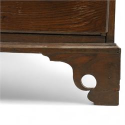 Mid 18th century oak tallboy chest, the projecting cavetto-moulded cornice over two short and three long drawers to the upper section, the lower section with three further graduated long drawers, each drawer with oak linings and fitted with later brass swan-neck handles, flanked by stop-fluted quarter columns, all raised on shaped bracket feet