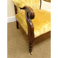  William IV rosewood framed open arm chair, scrolled back and lotus carved arms, on ring turned supports with brass sockets and castors  