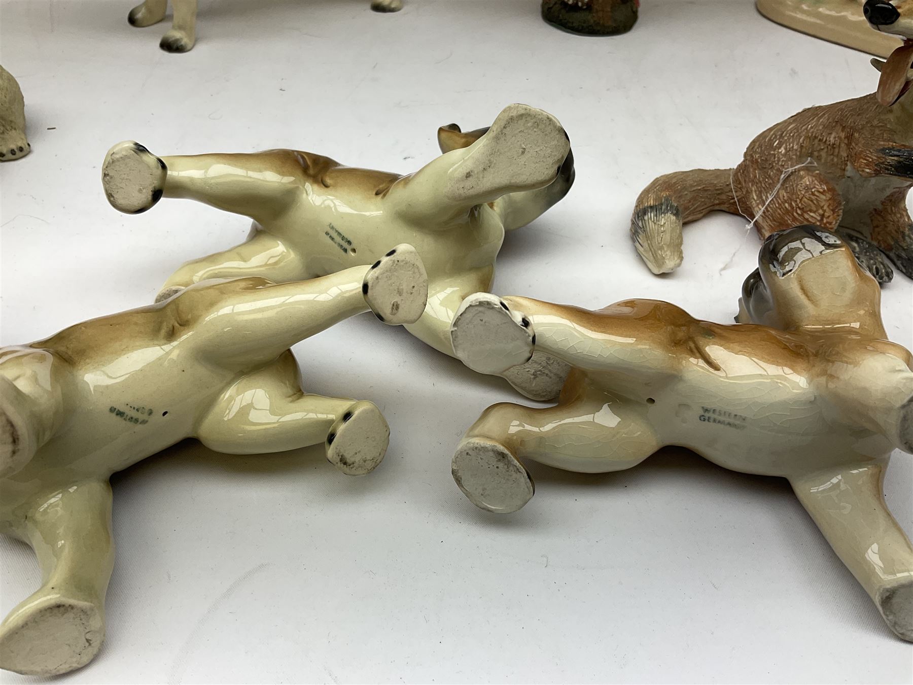 Three West German figures of Boxer dogs, Coopercraft figure of a dalmatian, Crested ware owl, West German horse figure group, Basil Matthews studio fox figure, Wade and other ceramic and composite  animal figures
