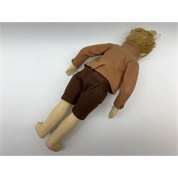 Lenci pressed felt boy doll c1930 the swivel  jointed head with blonde hair, painted side glancing brown eyes, smiling mouth with teeth, jointed body with stitched middle fingers, dressed in brown toned felt shirt, jacket and shorts H42cm