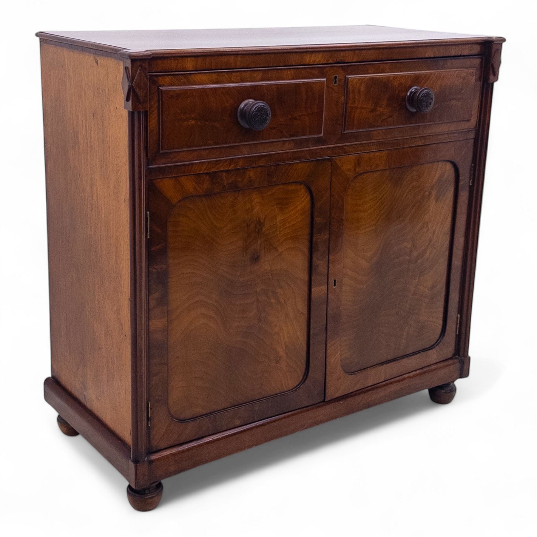 Regency mahogany secretaire cabinet, rectangular top over fitted secretaire drawer enclosing a tooled leather writing surface and pigeonholes, above a pair of panelled cupboard doors, raised on bracket feet