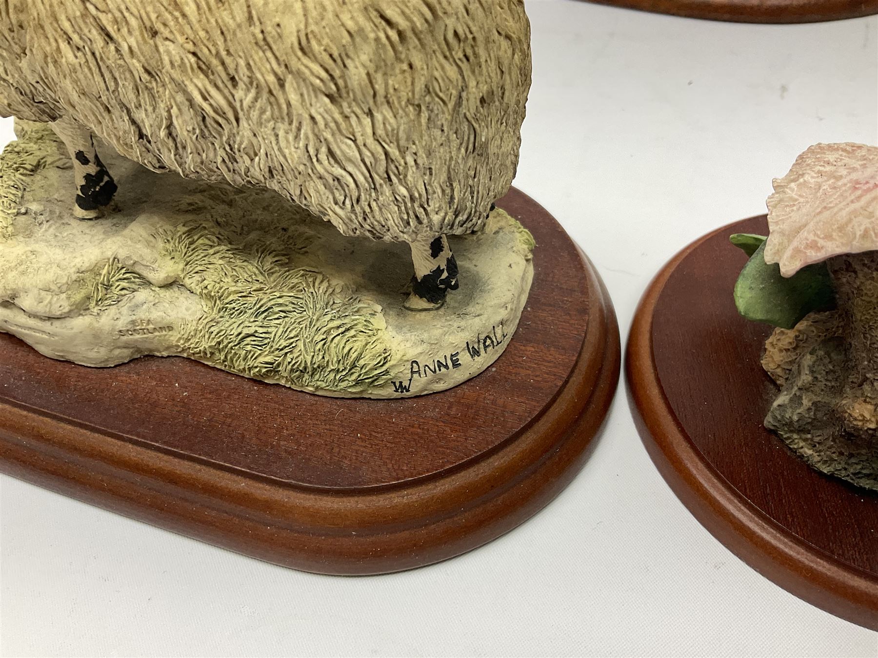 Three Border Fine Arts figures including Boxer with Pups, Capodimonte figure of a drunken pirate, and a brass dog (5)