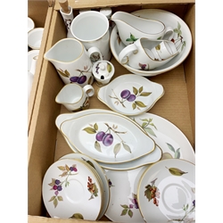 Royal Worcester Evesham pattern dinner and tea wares, to include six dinner plates, six salad plates, six dessert plates,  thirteen side plates, four tureen and covers, gravy boat and saucer, pair of cruets, six ramakins, large bowl, various flan and serving dishes, teapot, coffee pot, ten teacups and eleven saucers, open sucrier, milk jug, etc. (Qty). 