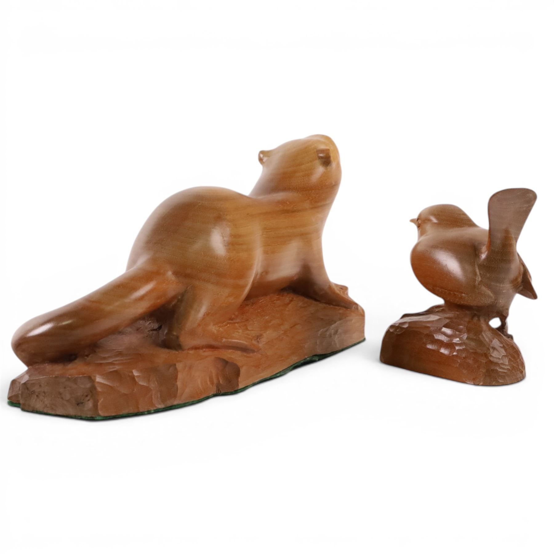 20th century walnut carvings, the first modeled as a wren, the second an otter, H  Two Yorkshire style walnut carvings, of a wren and otter, otter H10cm