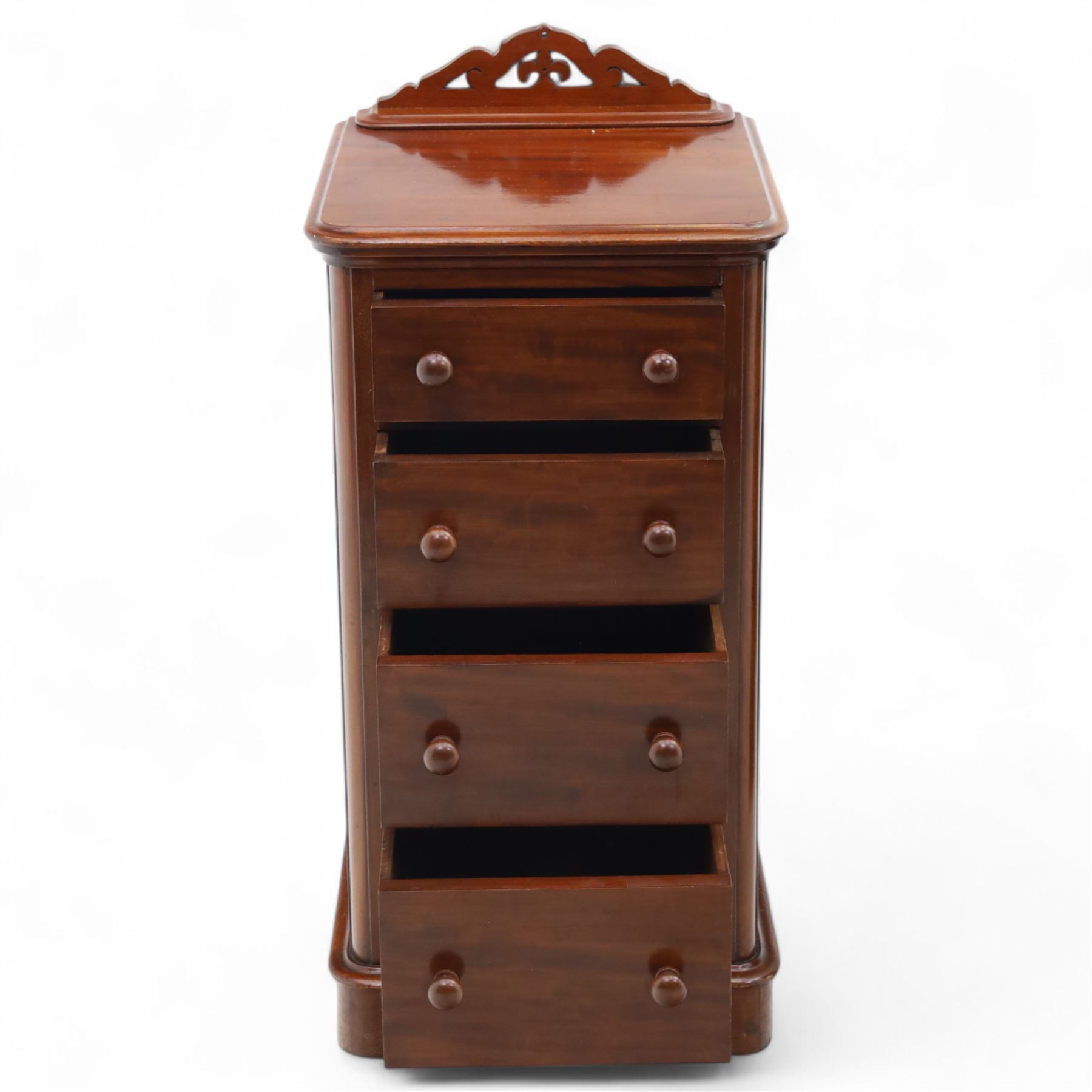 Pair of tall Victorian mahogany bedside chests, of narrow upright form, rectangular top with moulded edge, the back with raised pierced fretwork gallery, above four graduated drawers with knob handles, raised on a plinth base 