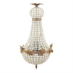 Late 19th century pair of French Empire gilt metal and cut glass bag chandelier, the tapering body formed of faceted glass button drops, with lobed lower bowl, cast foliate and mask mounts, surmounted by a bulbous upper section and terminating with a pendant finial