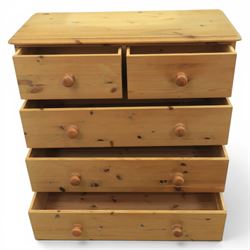 Solid pine chest, fitted with two short and three long drawers