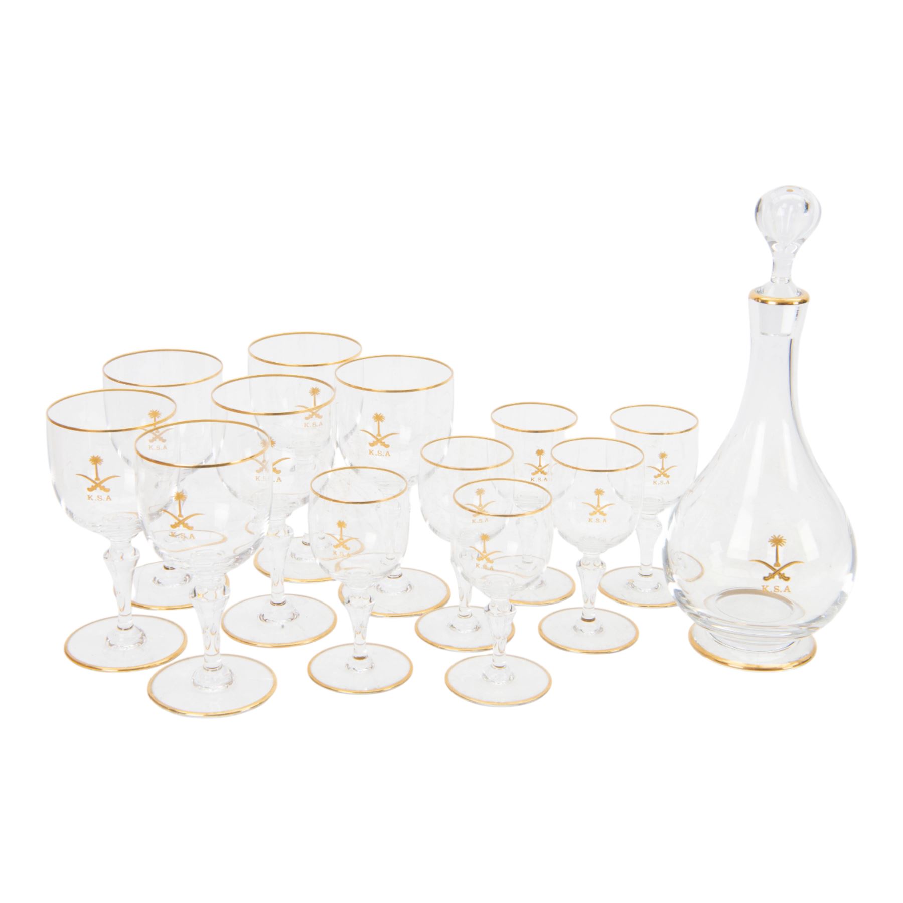 Baccarat decanter, six wine glass and six port glasses,  all with a gilt band to the rim and foot and motif for Kingdom of Saudi Arabia