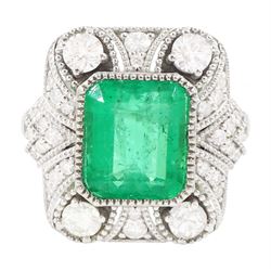 Platinum emerald and diamond cluster ring, single octagonal cut emerald of 2.52 carat, surrounded by milgrain set round brilliant cut and single cut diamonds, stamped PT950, total diamond weight 0.82 carat