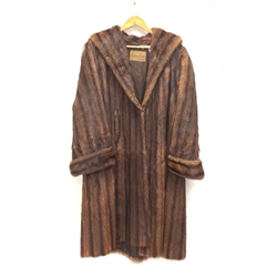 A lined Musquash fur coat. 