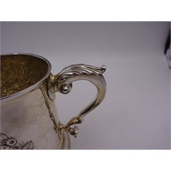 George III silver tankard, of slightly tapering cylindrical from, with chased and repousse crown above a monogrammed cartouche and floral, foliate and C scroll decoration, with acanthus capped C scroll handle, hallmarked WT, possibly William Turton, London 1774, H11.5cm