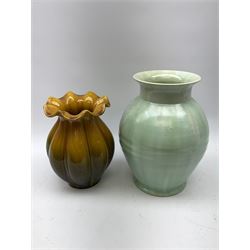 A group of assorted pottery, to include a large ribbed vase, of ovoid form with celadon type glaze, H29.5cm, reeded vase with frilled rim and merging yellow and brown glaze, H23.5cm, Irish Youghal vase, Brook New Forest vase, square sided blue glazed square sided bowl with pinched corners, etc. 