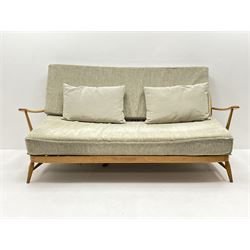 Ercol Windsor beech framed three seat sofa upholstered in a neutral fabric 