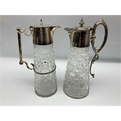 Pair of Mappin and Webb silver plate pierced pedestal bon bon dishes, together with other silver plate comprising teapot stand engraved with lion's head to centre, two cut glass claret jugs, two bottle coasters with acorn decoration, two open salts upon dolphin mounts, tea caddy, three piece cruet set and a large oval tray with pierced sides and upon four ball feet