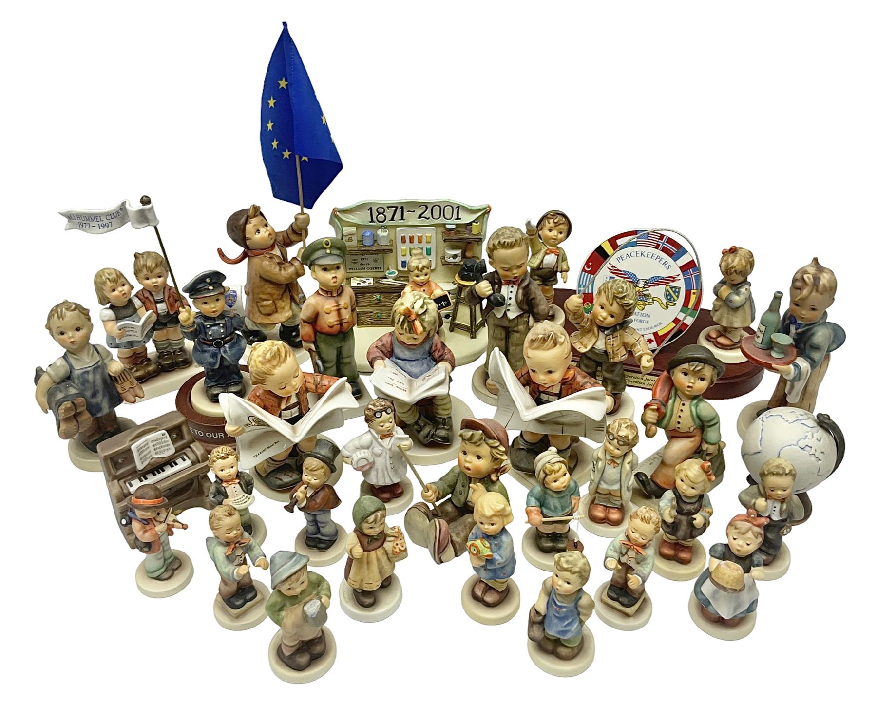 Thirty Hummel figures by Goebel, to include Saluting the Peacekeepers of Operation Joint Endeavor, on wooden plinth, Call to Glory, Celebrate with Song and Soldier Boy