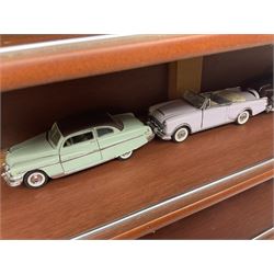 Franklin Mint 'The Classic Cars of the Fifties' collection with display rack, eleven (ex.12) die-cast models and folder of paperwork; another wall mounting display cabinet containing fifteen die-cast models; and an unused boxed Master Tools model display case