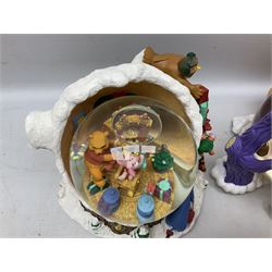 Six Disney Winnie the Pooh Christmas snow globes, comprising large Mr Christmas Holiday Snowfall, An Enchanted Christmas, It's A Small World Christmas 1994,  Tree Trimming, 1995 Christmas At Our House and Christmas Band Concert, together with Mr Christmas Holiday Go Round, all with boxes (7)