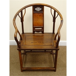  Pair of Huanghuali type horseshoe back open arm chairs, pierced and figured panel splats with solid seats on shaped supports with stretchers, (2)  