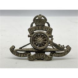 Trench Art - three WW2 brass shell case ashtrays, one mounted with Royal Artillery cap badge and button and one mounted with RA button; together with a pair of place name holders each formed from a Royal Artillery cap badge (5)