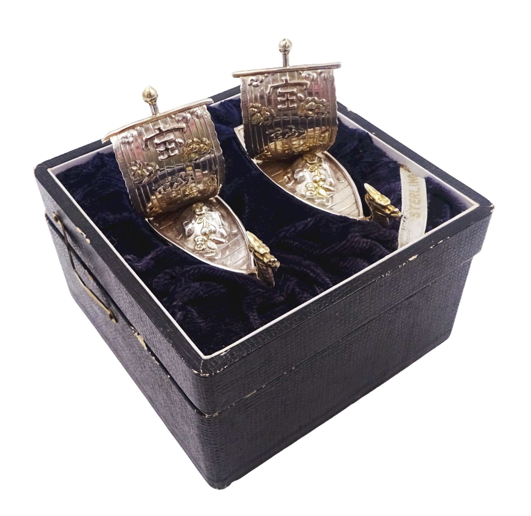 Pair of 20th century Japanese silver novelty cruets, modelled in the form of Viking long ships, marked Sterling Japan, contained within a fitted case, approximate silver weight 1.18 ozt (36.6 grams)