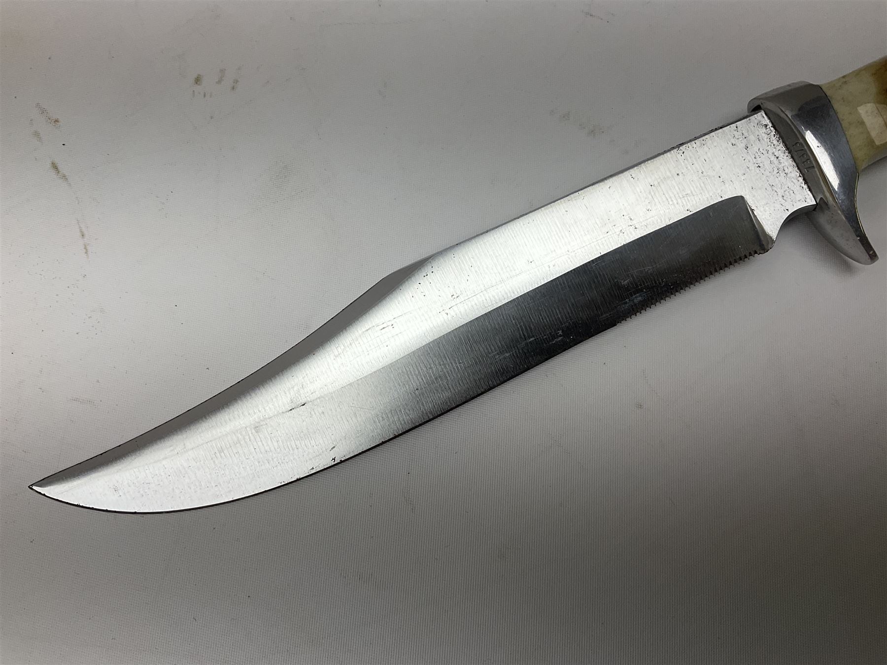 German Original Puma-Bowie knife, with maker's name and number 6396 to the 16.5cm blade, stamped number 73373 to the guard, antler grip, in original hard plastic case with brown leather sheath, also marked Puma