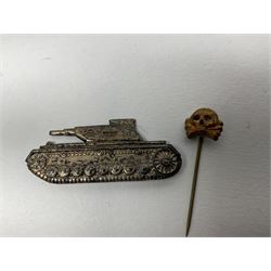 Collection of eleven German metal and cloth badges and uniform buttons including driver's badge, two 'SS' fabric skulls, private's shoulder tabs, Police cloth badge, tank destruction badge, medal bars and ribbon etc; most WW2 period