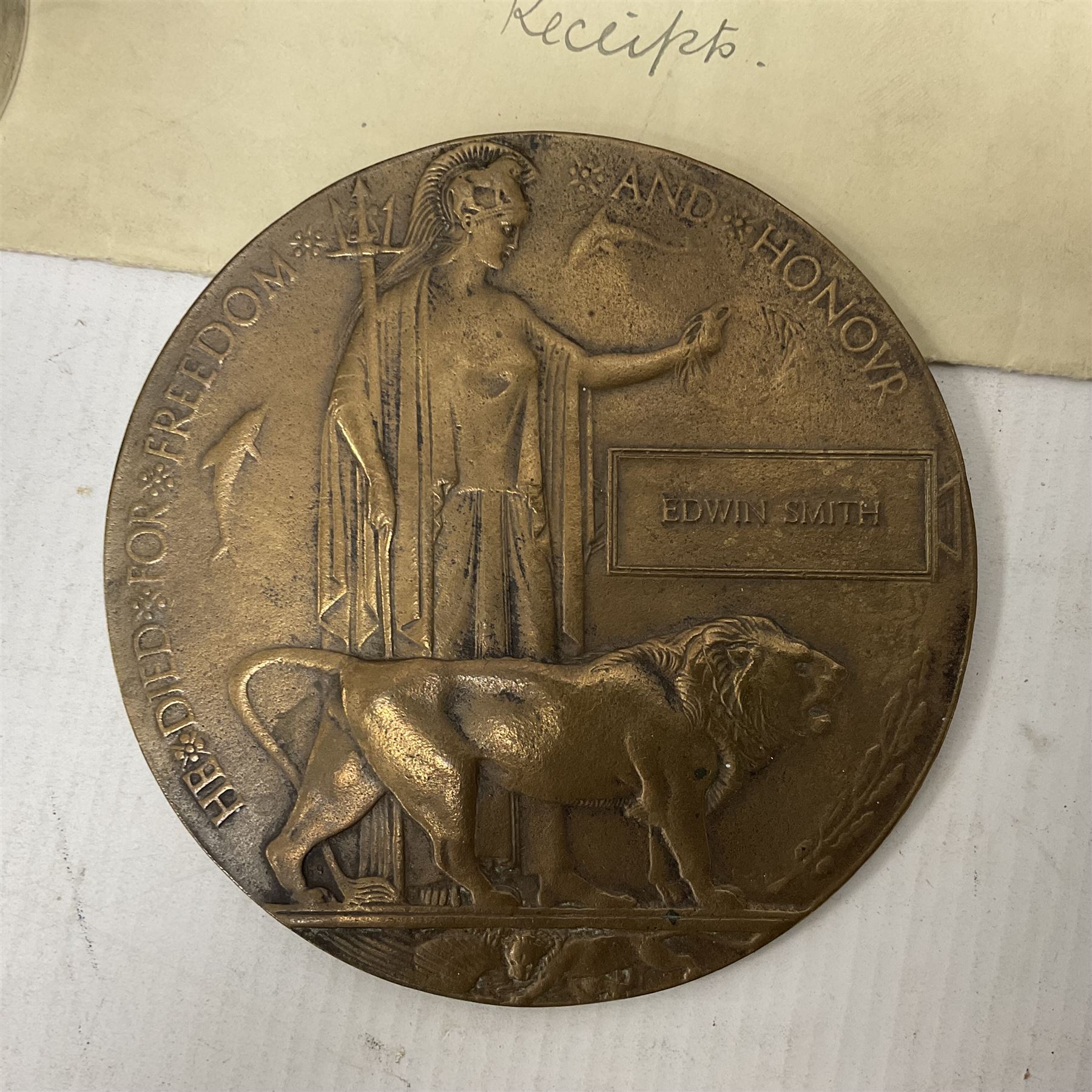 WWI bronze death plaque to Edwin Smith, together with two tankards presented to E.Smith and photographs of his family  